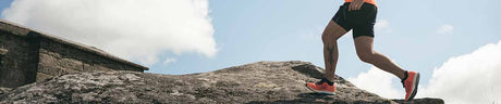 image of man jogging up mountain